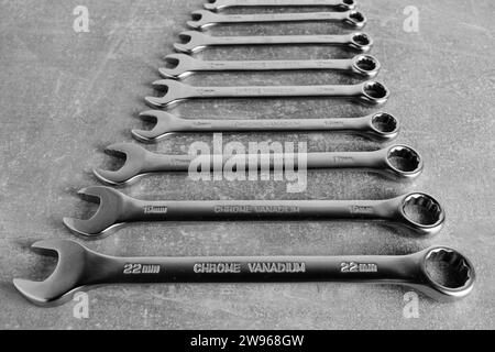 Set of wrenches gray concrete background Stock Photo