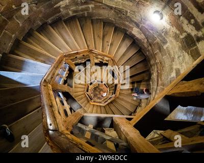 man walking up the staircase in the old castle Stock Photo