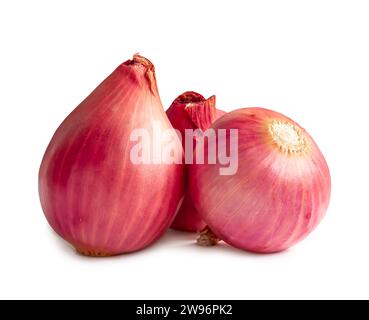 Three fresh red onion bulbs in stack are isolated on white background with clipping path. Stock Photo
