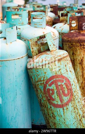Still life of a collection of rusted and decaying steel propane tanks found in a junkyard Stock Photo