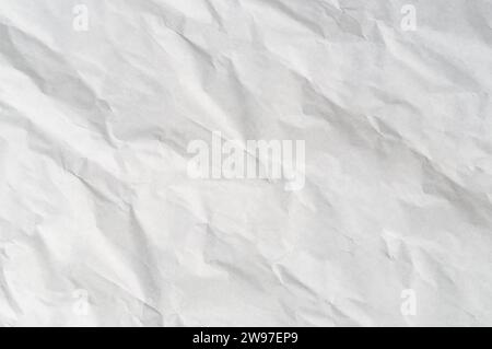 Wrinkled or crumpled white stencil paper or tissue after use in toilet or restroom with large copy space is used for background texture in art work. Stock Photo