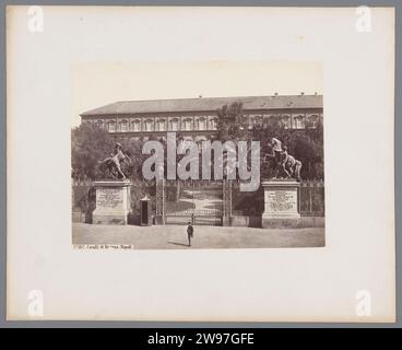 Two bronze sculptures of horses at the entrance of the Royal Palace in Naples, Italy, Giorgio Sommer, After Anonymous, 1856 - 1914 photograph  Naples cardboard. paper albumen print gate, entrance. villa. monument, statue. piece of sculpture, reproduction of a piece of sculpture Royal Palace of Naples Stock Photo