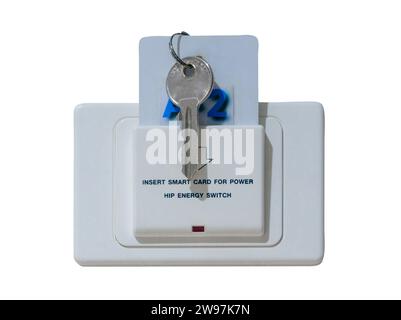 Smart card with key inserted into white socket with text reading Insert smart card for power installed on white wall in luxurious hotel or resort room Stock Photo