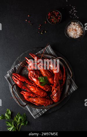 boiled crayfish on a black plate. High quality photo Stock Photo