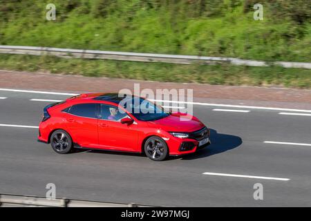 2022 Honda Civic Sport Hybrid Electric 1993 cc car travelling at speed on the M6 motorway in Greater Manchester, UK Stock Photo