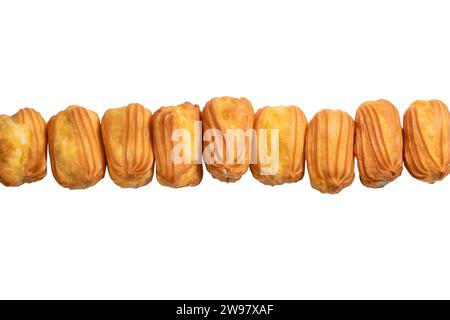 Sweet eclairs isolated on a white background. Top view. Stock Photo