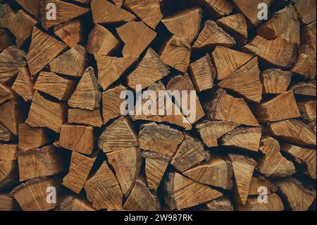 stacked firewood from 2023. High quality photo Stock Photo