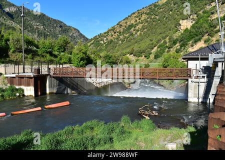 Water flowing over the Third Dam on the Logan River next to Highway 89 in Utah Stock Photo