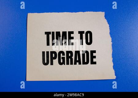 Time to upgrade lettering on ripped paper. Business concept photo. Stock Photo