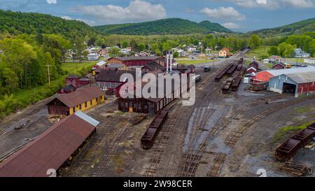 An Aerial View of a Narrow Gauge Train Yard, With Coal Hoppers, Shops and Roundhouse, on a Sunny Spring Day Stock Photo