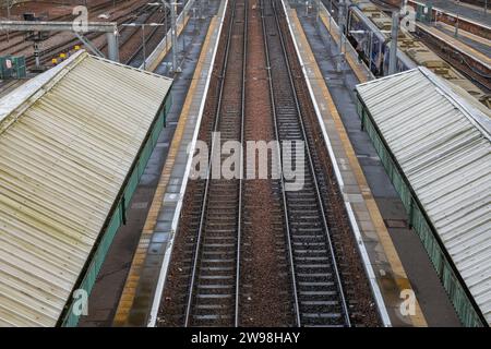 Edinburgh Waverley main railway station platforms and tracks, city infrastructure in Edinburgh in Scotland, UK. Stock Photo