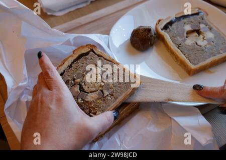 Périgord, France. December 25, 2023. Foie gras at Christmas meal in France. In France, and particularly in Périgord, duck or goose foie gras is one of the traditional dishes of the Christmas meal. Preparation of four different foie gras recipes before eating it during the meal. Photo by Hugo Martin/Alamy Live News. Stock Photo