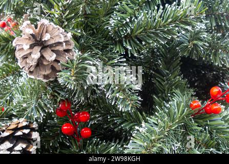 Artificial Christmas pine tree decor close-up. fur needle, fur needles, pine needle, pine needles, green needles tree, artificial frost needles Stock Photo