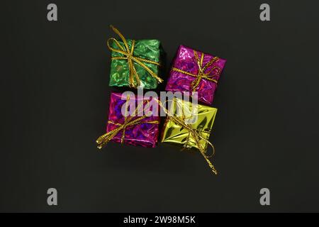 Colorful Gift boxes isolated on black background. top view. Stock Photo