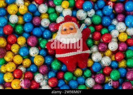 Santa Claus and colorful Christmas ball background. Stock Photo