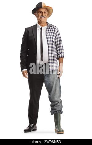 Mature man, half dressed as a businessman, half as a farmer isolated on white background Stock Photo