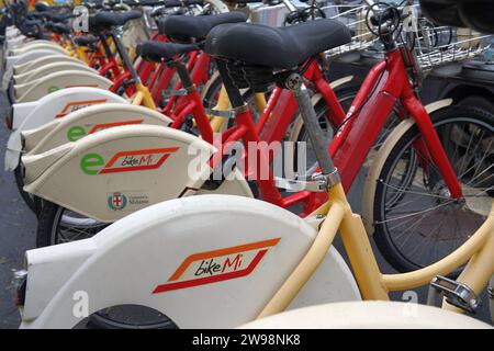 Hire Bikes lined up in a row in public in Milan, Italy Stock Photo