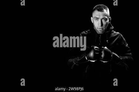 Mixed martial artist stands with his hands up. Concept of mma, ufc, thai boxing, classic boxing. Mixed media Stock Photo