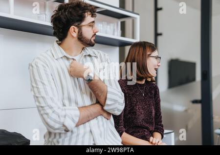 Business people collaborating on analyzing project and discussing statistics. Stock Photo