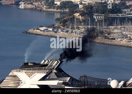 Pollution from cruise ships, the Celebrity Infinity from Celebrity Cruises and MSC Musica in the cruise harbour. The MSC Musica blows dark exhaust Stock Photo