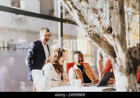 Diverse team discussing project details, collaborating on tasks, and planning for business growth and success. Stock Photo
