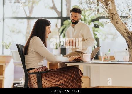 Multicultural team of workers collaborating in office for business success. Stock Photo