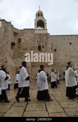 Palestinians arrive for Christmas events at the Church of Nativity Palestinians arrive for Christmas events at the Church of Nativity on December 24, 2023 in Bethlehem, West Bank. Last month, Christian Palestinian leaders here called off public Christmas celebrations, citing the effects of the ongoing war in Gaza. Regarded by Christians as the birthplace of Jesus, Bethlehem is usually bustling with foreign tourists this time of year, with streets full of holiday decoration and vendors selling ornaments and festive figurines. Israel s war against Hamas that was sparked by the Oct. 7 attacks has Stock Photo