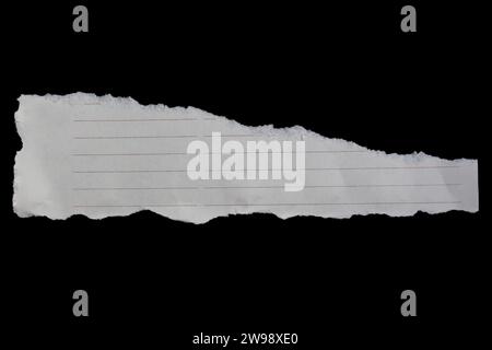 Ripped paper piece isolated on black background. Torn paper with copy space. Stock Photo
