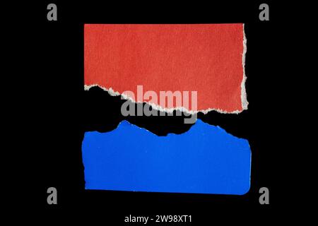 Ripped paper piece isolated on black background. Torn paper with copy space. Stock Photo