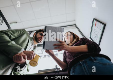 Business colleagues collaborating on a new project in a creative office. Stock Photo