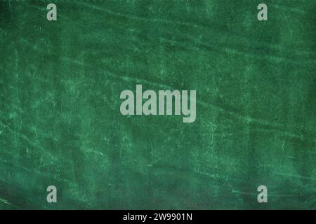 Background is made of green genuine leather. Abstraction. Stock Photo
