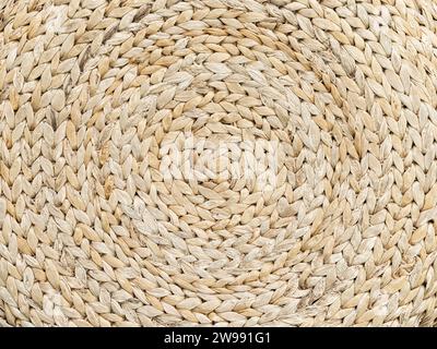Background is made of woven straw. Circular pattern. Stock Photo