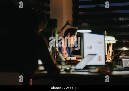 A group of business professionals collaborating on project details, analyzing statistics, and discussing strategies for growth and success. Stock Photo