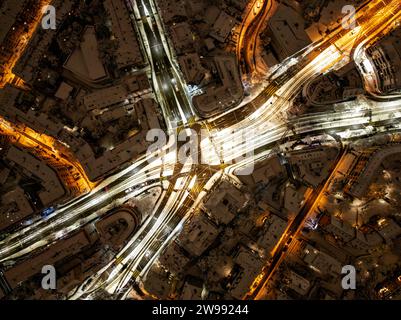 An aerial photograph of the city of Zurich, Switzerland at night covered in snow Stock Photo