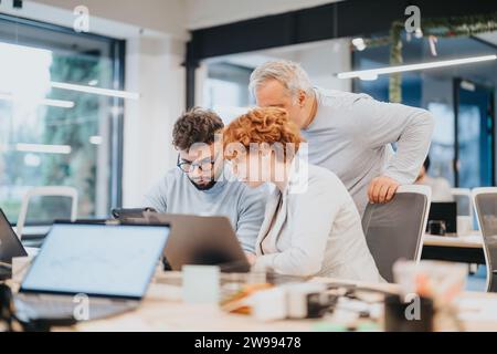 Diverse business team collaborates on strategies, market analysis, and sales for financial growth. Stock Photo