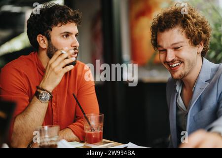 Successful Meeting of Architects and Engineers Discussing Blueprint at Coffee Bar Stock Photo