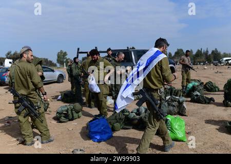 (231225) -- ISRAEL-GAZA BORDER, Dec. 25, 2023 (Xinhua) -- Israeli soldiers back from battles in Gaza are seen at a staging area near Israel-Gaza border in southern Israel, on Dec. 25, 2023. At least two soldiers were killed on Monday in battles in Gaza, said the Israeli military, bringing the total death toll of Israeli soldiers since the outbreak of the conflict between Israel and Hamas to 156. (Tomer Neuberg/JINI via Xinhua) Stock Photo