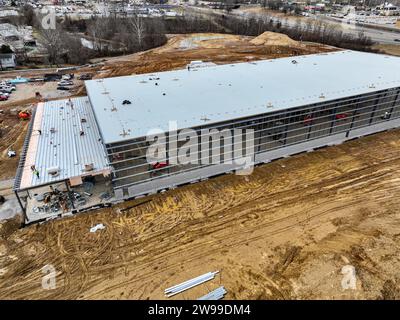 A bird's-eye view of the foundational groundwork of a vast industrial facility, with materials and earthmovers dotting the early construction Stock Photo
