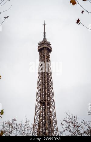 The Eiffel Tower in Paris framed by autumn branches - France Stock Photo