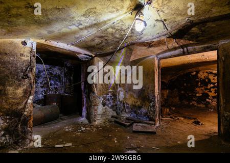 Dark vaulted corridor in old abandoned building. Stock Photo