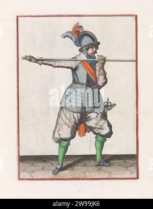 Soldier who carries his skewers with both hands horizontally at shoulder height, his right hand at the foot of the weapon, Jacques de Gheyn (II) (workshop or), after Jacques de Gheyn (II), c. 1597 - 1607 print A soldier, who leans out a skewer (lance) with both hands horizontally at shoulder height, his right hand at the foot of the weapon. This is the third action for lowering the skewers to be able to go through under an eerby. This print is part of the series of 32 hand -numbered prints of skewers in the arms handling. The Hague paper engraving handling of weapons  military training. helve Stock Photo