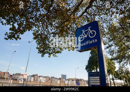 Picture of a sign indicating Deelfiets, meaning, bicycle sharing, on a station in Maastricht, Netherlands. Stock Photo