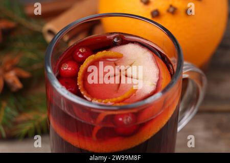 Aromatic mulled wine in glass cup on table, closeup Stock Photo
