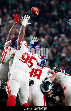 Philadelphia, United States. 25th Dec, 2023. New York Giants defensive tackle Jordon Riley (95) and defensive tackle D.J. Davidson (98) try to block an extra point from Philadelphia Eagles place kicker Jake Elliott (4) during the second half of NFL action at Lincoln Financial Field in Philadelphia on Monday, December 25, 2023. Photo by Laurence Kesterson/UPI Credit: UPI/Alamy Live News Stock Photo