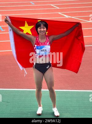 (231226) -- BEIJING, Dec. 26, 2023 (Xinhua) -- As the sporting calendar draws to a close, Xinhua News Agency has selected the top 10 Chinese athletes/teams for 2023:4. Wen Xiaoyan (female, para athletics) Wen won gold medals in all four events that she competed in at the Hangzhou Asian Para Games -- the women's 100m T37, 200m T37, long jump T37/38 and 4x100m mixed relay. She also set new world records in the three individual events and a new Asian record in the relay. This file photo taken on Oct. 25, 2023 shows Wen Xiaoyan of China celerbating after the women's 200m-T37 final of Athletics at Stock Photo