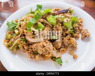 duck mince with spicy taste, Thai food (Larb ped) on wood table Stock Photo