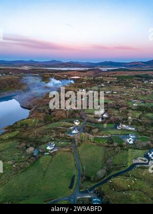 Smoke over Lough Fad due to traditionally burning of waste in rural Ireland - County Donegal. Stock Photo