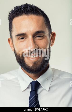 Bearded man with a pleasant smile projects professionalism and approachability Stock Photo