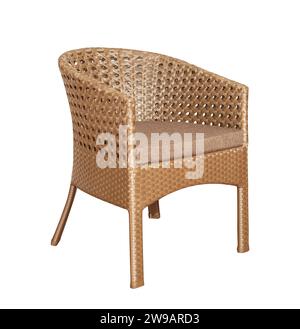 Armchair with soft pillows isolated on white. Wicker rattan furniture for the garden. Stock Photo