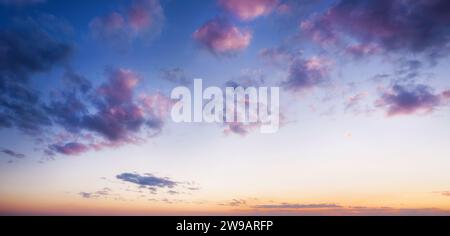 Beautiful evening sky with clouds at dusk . Sunset sky background. Stock Photo